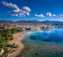 From ancient Kolona towards the harbor Aegina, aerial view, beach, coastline, Greece, panorama, sea, summer, travel, turquoise water