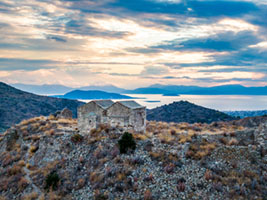 Sunset Hues over the Twin Churches of Palaiochora Aegina, Agios Dimitrios, Agios Georgios, Agios Nektarios, Byzantine, Christianity, Greece, Paliachora, aigina, ancient, architecture, church, churches, culture, ghost town, heritage, hilltop, historic site, history, landmark, landscape, medieval, monastery, palaiochora, palaiohora, palaioxora, religion, ruins, travel, ΑΙΓΙΝΑ, παλαιοχωρα