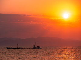 Golden sunset over sea horizon with boat silhouette, Greece Greece, boat silhouette, horizon, sea, sun, sunset, travel