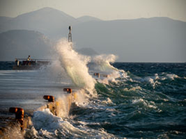 Storm at the harbor Aegina harbor, stormy sea, Mediterranean atmosphere, dramatic clouds, Greek coastline, moody seascape