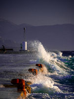 Storm at the harbor Aegina harbor, stormy sea, Mediterranean atmosphere, dramatic clouds, Greek coastline, moody seascape