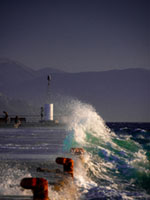 Storm at the harbor Aegina harbor, stormy sea, Mediterranean atmosphere, dramatic clouds, Greek coastline, moody seascape