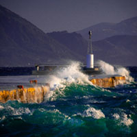 Storm at the harbor Aegina harbor, stormy sea, Mediterranean atmosphere, dramatic clouds, Greek coastline, moody seascape