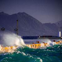 Storm at the harbor Aegina harbor, stormy sea, Mediterranean atmosphere, dramatic clouds, Greek coastline, moody seascape