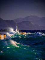 Storm at the harbor Aegina harbor, stormy sea, Mediterranean atmosphere, dramatic clouds, Greek coastline, moody seascape