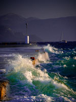 Storm at the harbor Aegina harbor, stormy sea, Mediterranean atmosphere, dramatic clouds, Greek coastline, moody seascape