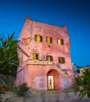 Markellos Tower Illuminated at Dusk Aegina, aigina, architecture, building, culture, Greece, Greek history, heritage, historic building, history, landmark, Markellos Tower, Mediterranean, old town, tower, travel
